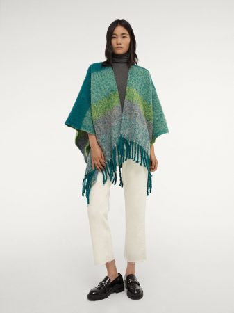 Poncho de punto con flecos Parfois