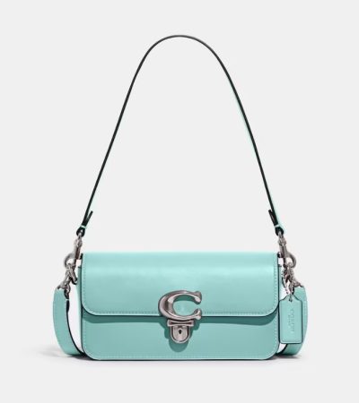 Dale un toque elegante a tu look con estos bolsos de El Corte Inglés 5 Merca2.es Bolso de hombro Studio de piel vacuna en azul con solapa Merca2.es