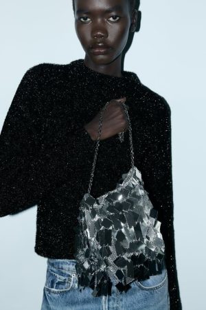 Bolso saca metalizada flecos