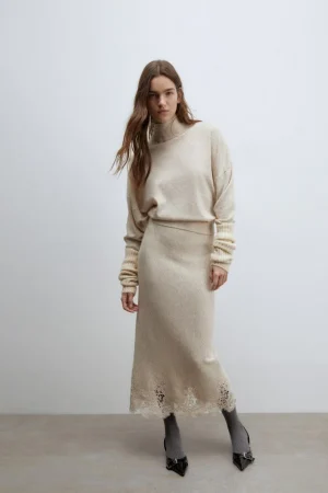 Falda midi detalle y jersey cuello perkins