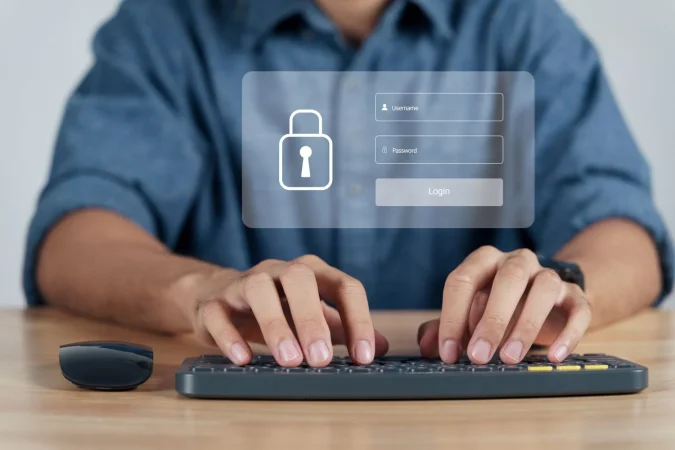 businessman protecting personal data computer with login virtual interfaces lock icon Merca2.es