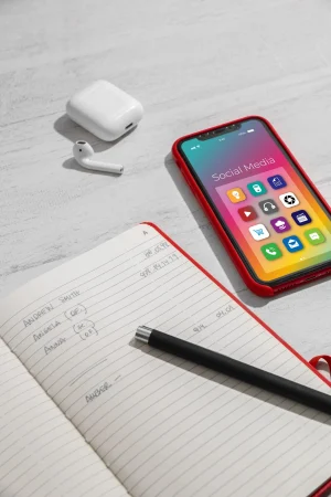 high angle smartphone notebook arrangement Merca2.es