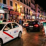 Imagen WhatsApp y taxis contra Uber. Diseñada con IA