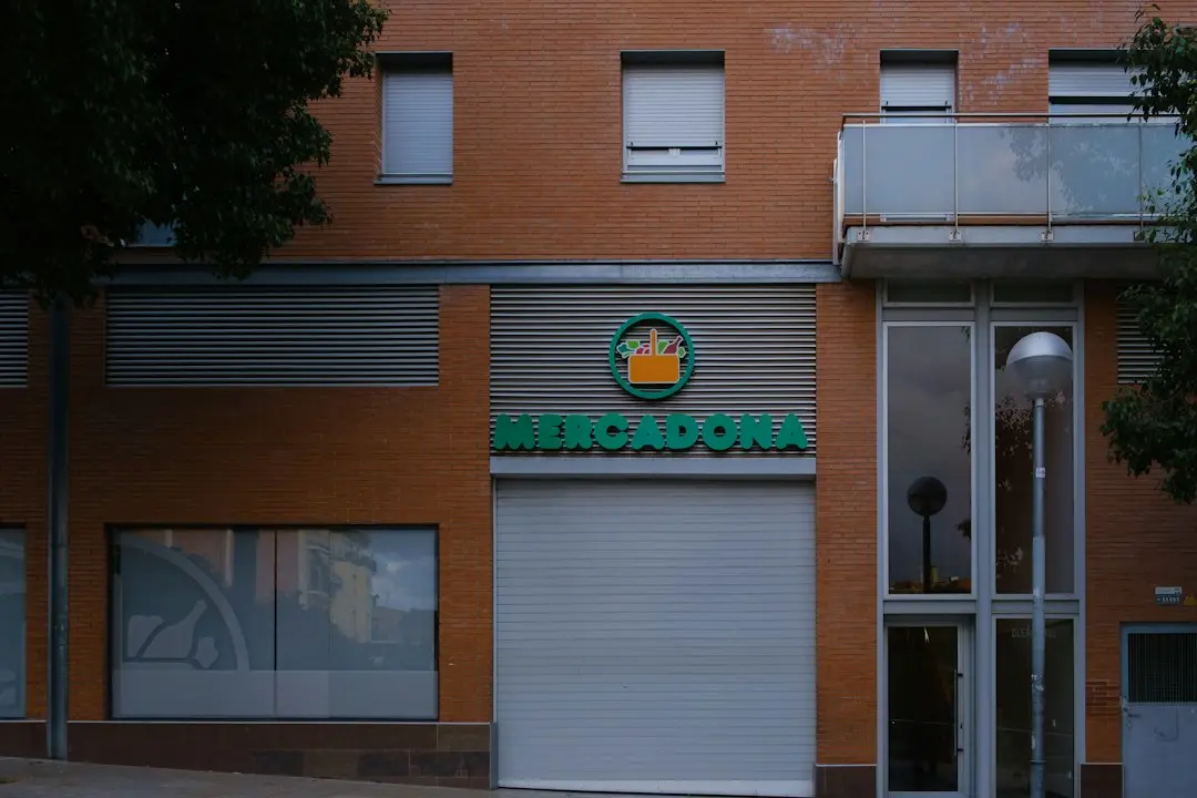 Mercadona supermarket storefront with orange brick building