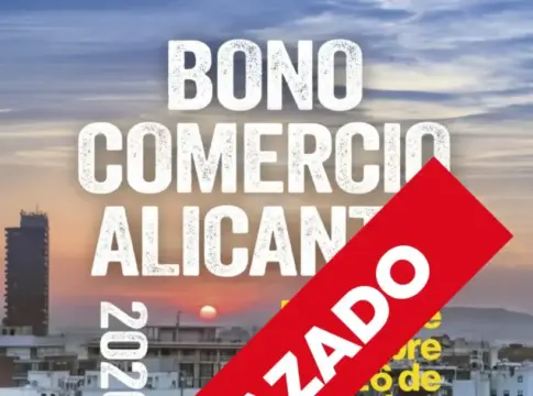 Cartel del Bono Comercio aplazado Cartel del Bono Comercio Alicante 2026 con una banda roja que indica aplazado.