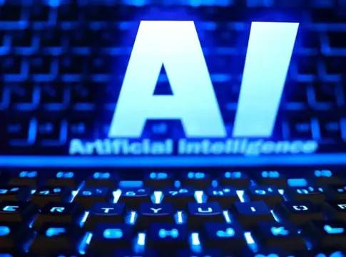 Letras AI sobre un teclado iluminado Teclado iluminado en azul bajo las letras AI y el texto Artificial Intelligence